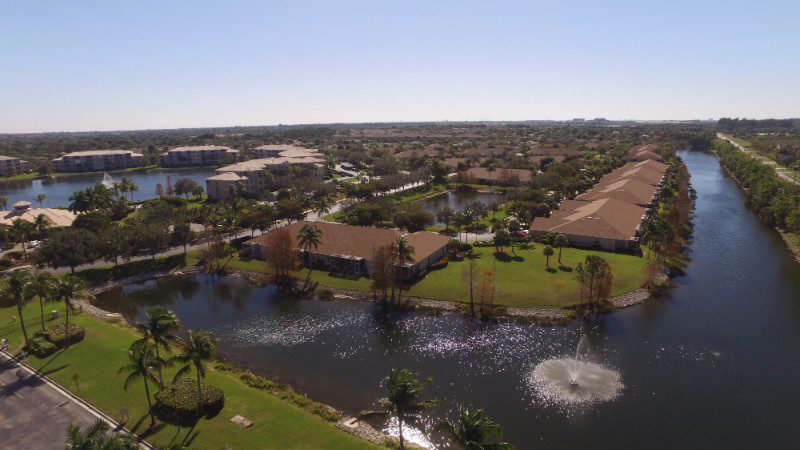 Aerial view of a lake and houses.