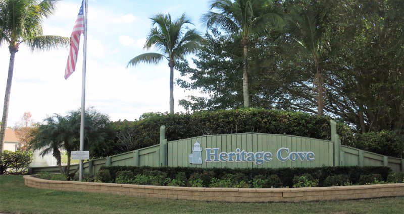 Heritage Cove community entrance with flag.