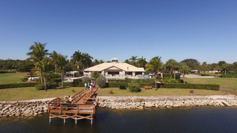 Community building with a dock and lake.