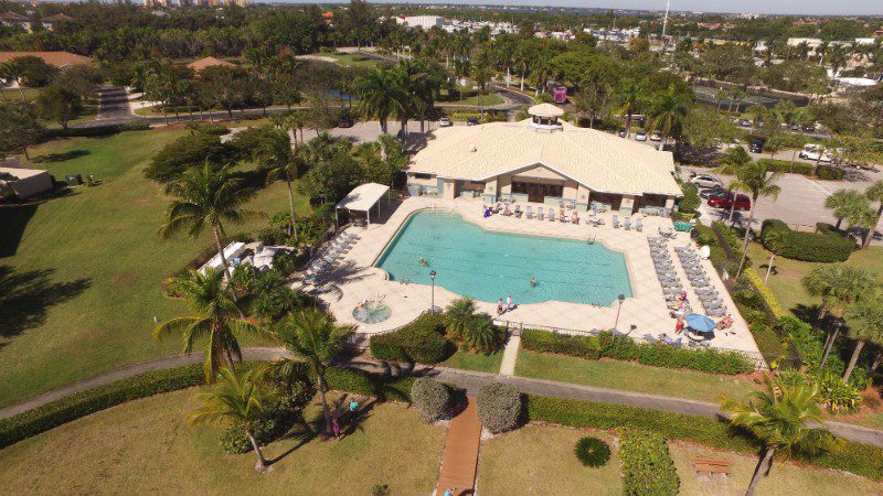 Aerial view of a pool and clubhouse.