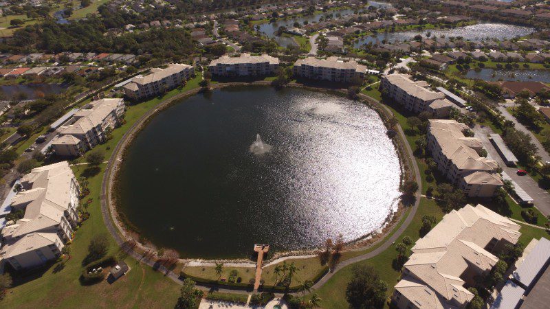 Aerial view of a lake and homes.